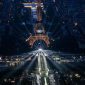 A photograph taken from an helicopter on July 26, 2024 shows an aerial view of the Eiffel Tower and the Olympics Rings lightened up during the opening ceremony of the Paris 2024 Olympic Games in Paris. (Photo by Lionel BONAVENTURE / POOL / AFP)